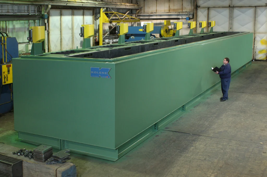 Operator beside a Kolene molten salt descaling line